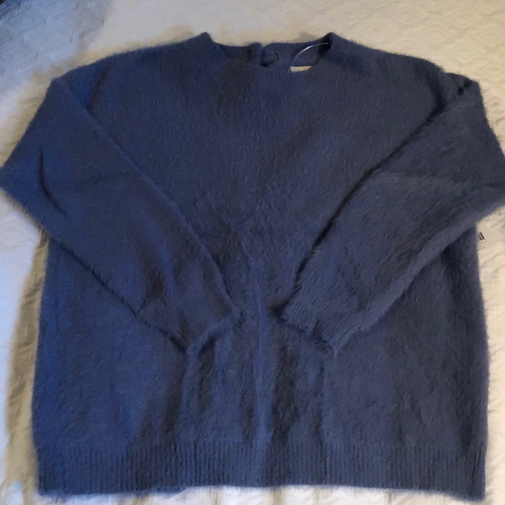 ee:some fuzzy open back/bow tied sweater